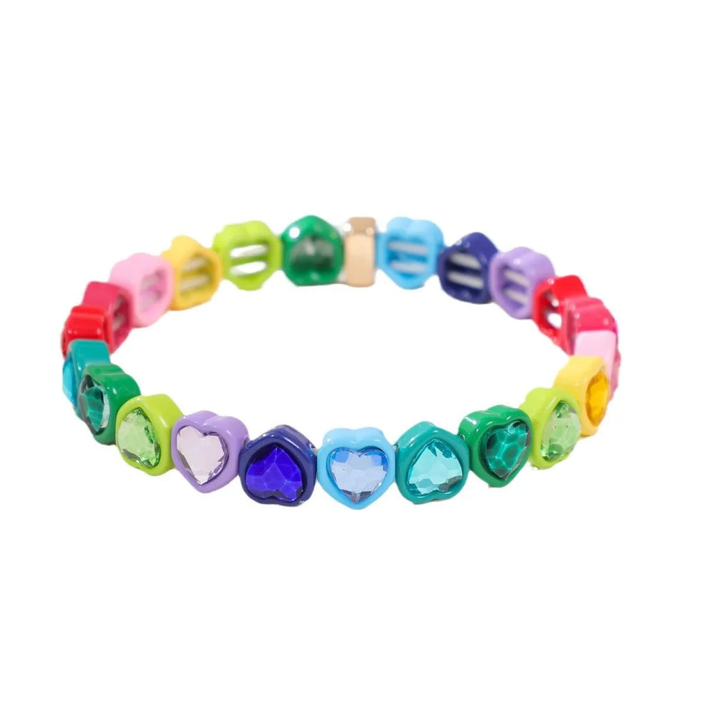 Colourful elastic bracelet with a shiny heart-shaped alloy charm on a stretch band.