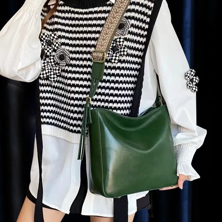 Genuine leather women's messenger bag with multiple internal compartments in black, sugar brown, golden brown, or dark green.