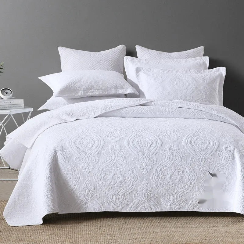 Double-sided pure cotton bed cover three-piece set in a light grey damascus pattern on a bed.