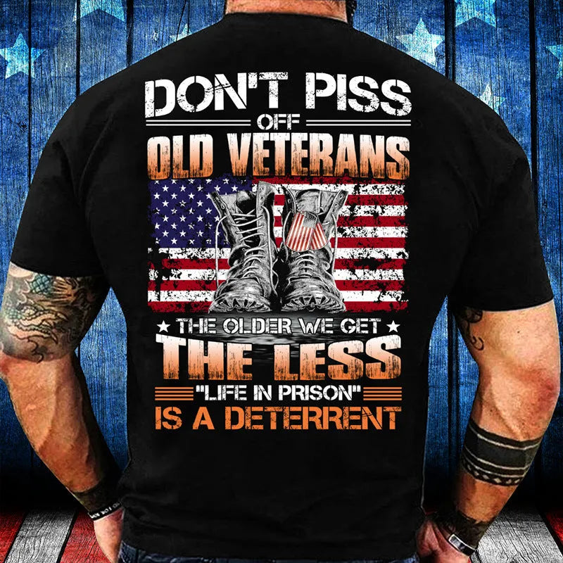 Mens black loose-fit polyester T-shirt with skull and slogan print on front, shown on model