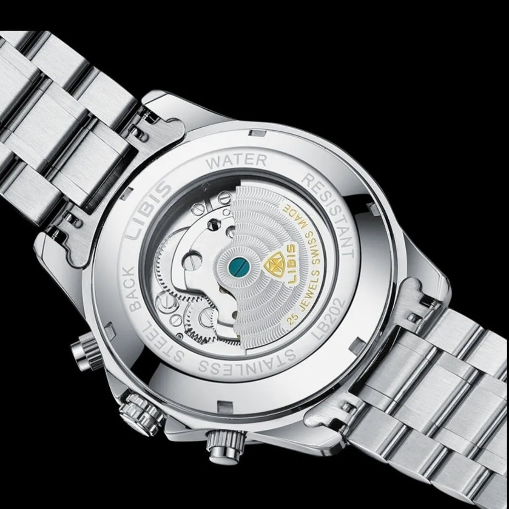 Silver stainless steel men's automatic perpetual calendar watch with sapphire glass on a wrist.
