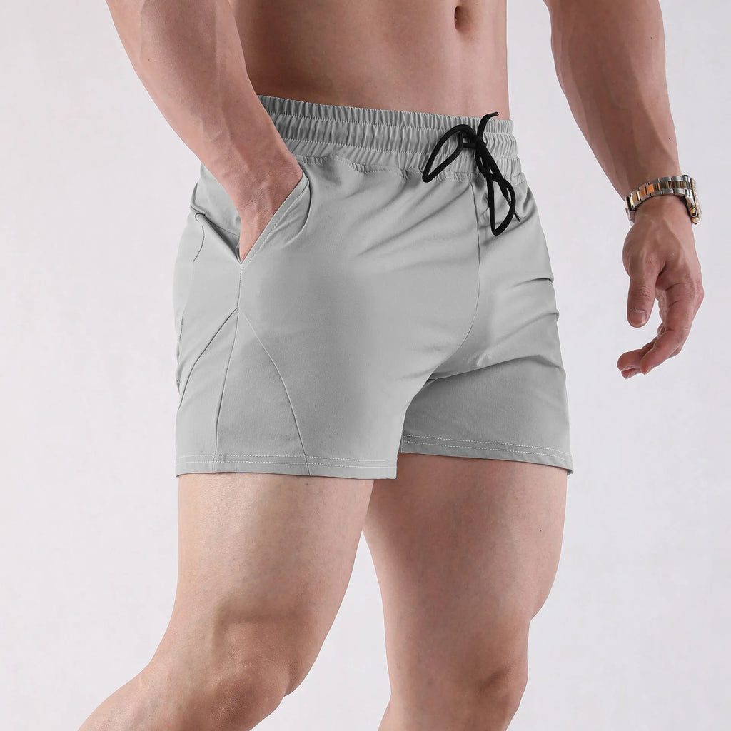 Men's thin grey polyester basketball shorts with an elastic waistband.