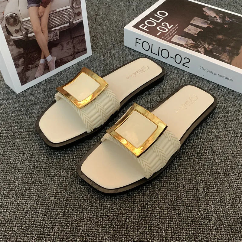 Women's apricot coloured flat summer slippers with a textured PVC sole.