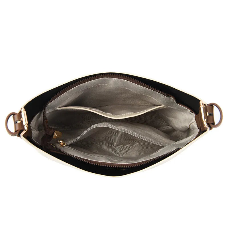 Black PU bucket bag with a single shoulder strap, showing contrast stitching and a lock detail.