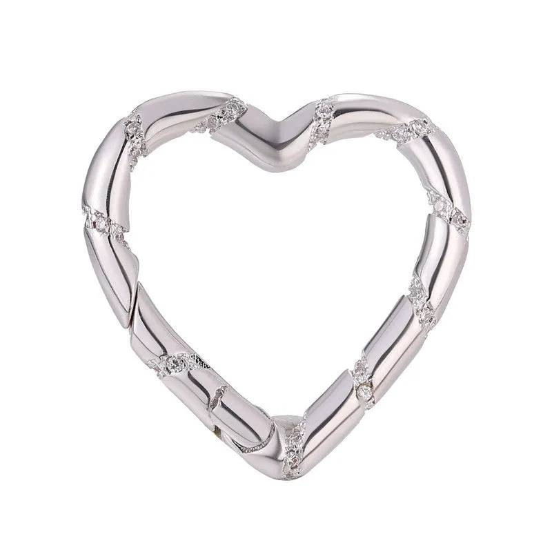 Copper climbing buckle with electroplated gold finish, shown as a heart spring fastener.