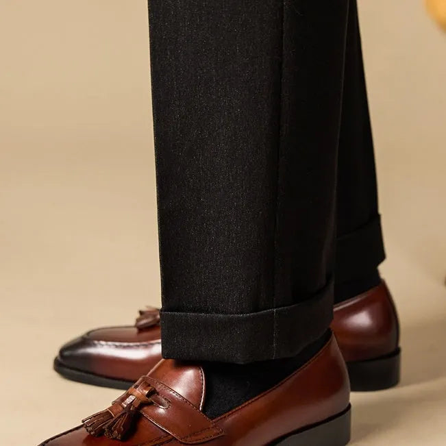 Men's polished leather tassel loafers in black and brown with pigskin lining and rubber sole