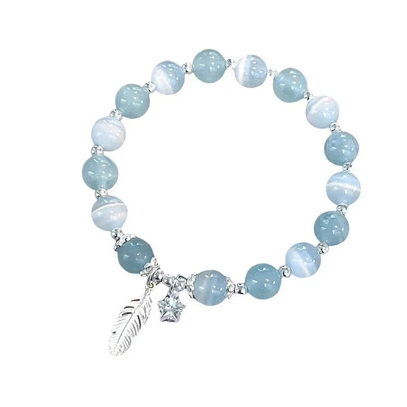 Korean style glass and coloured glaze crystal bracelet in feather XINGX blue moonlight colour with text detailing
