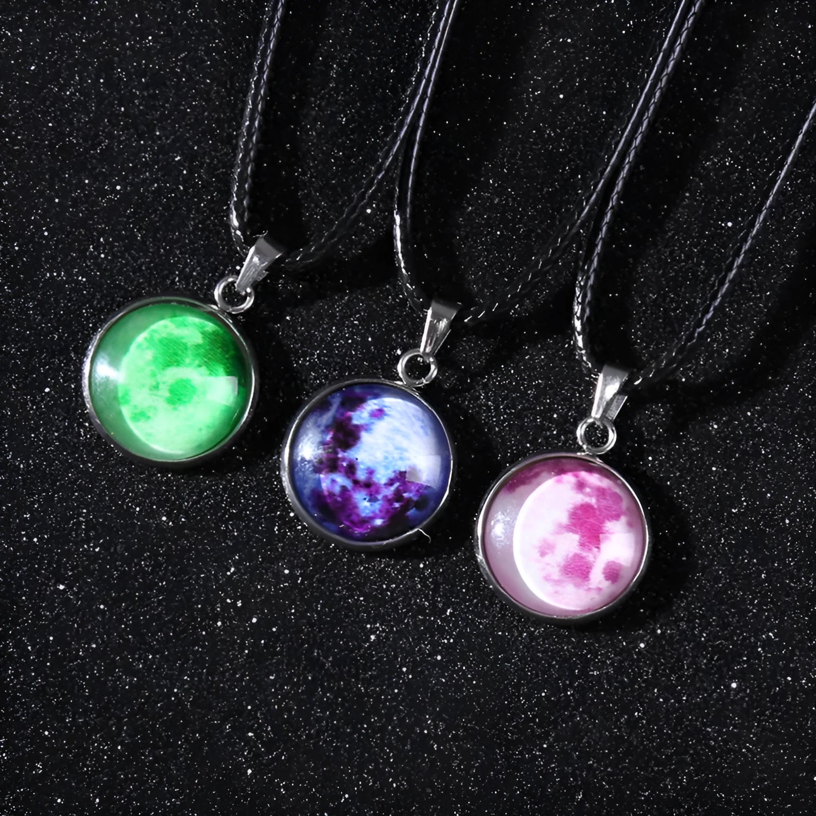Close-up of a luminous alloy necklace with a glass pendant featuring a Christmas moon night sky and constellation design.