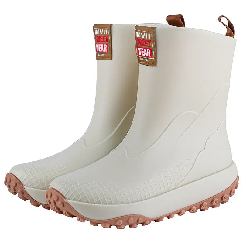 Men's PVC oversleeve rain boots in beige with a non-slip plastic sole.
