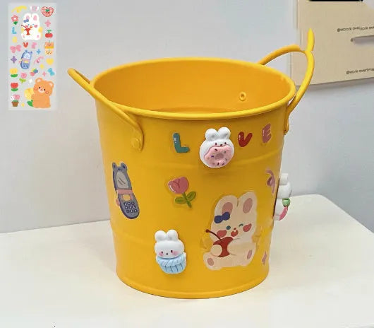 Round metal desktop pen holder storage box in a choice of colours including pink, green, red, white, and yellow.