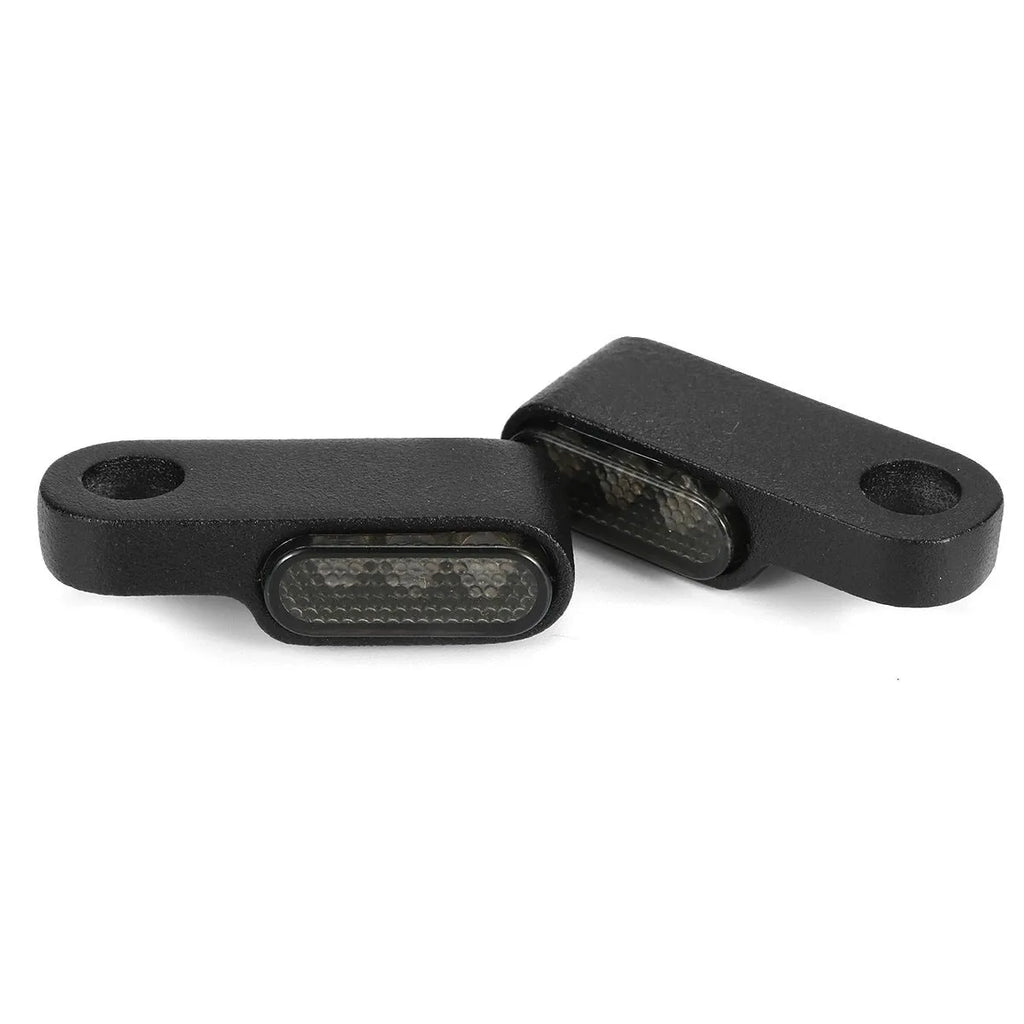 12V metal motorcycle handlebar turn signal with yellow light, shown in black or silver, single unit