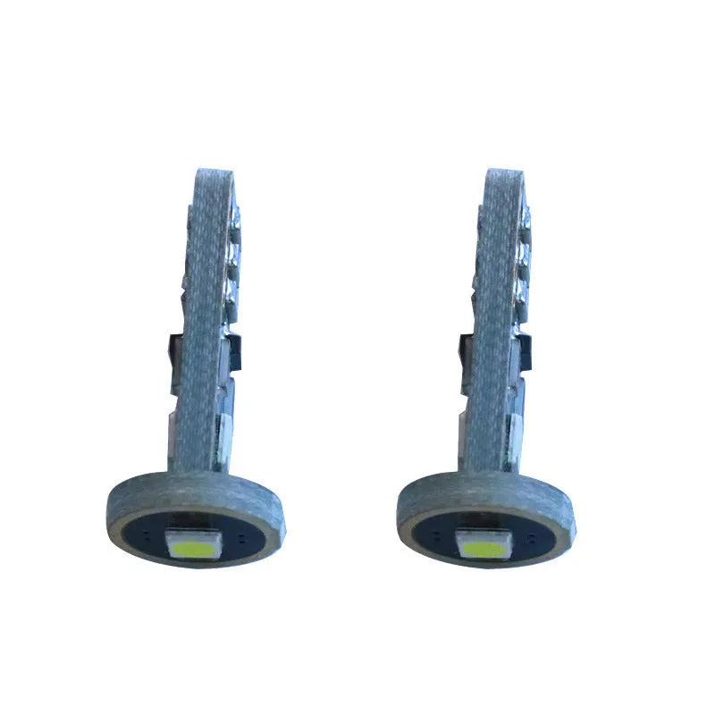 T10 W5W LED car light with blackboard white finish and compact 23mm x 9mm dimensions