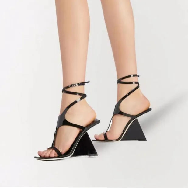 Women's black square-toe high heel sandals with a block heel and button fastening.