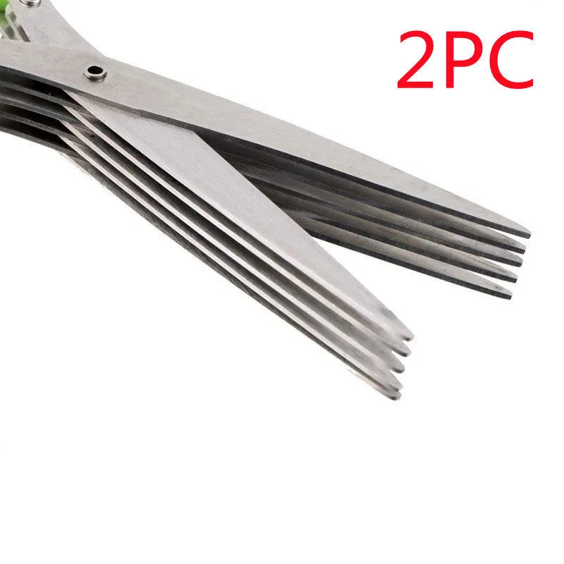 Stainless steel multi-layer kitchen scissors for cutting green onions and herbs on a chopping board.