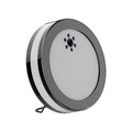 Black wireless smart surveillance camera with night vision and voice conversation on a desk