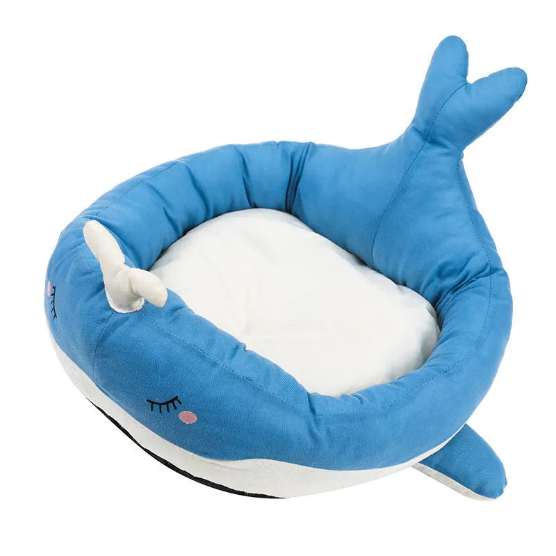 Blue duck-shaped fluffy pet bed for a small dog, showing raised rim and soft material.