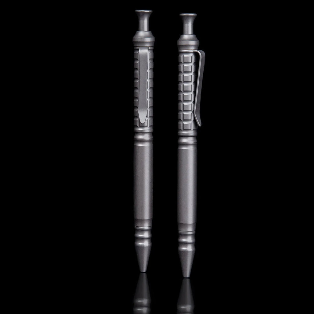 Gunmetal grey titanium alloy tactical pen with push-action decompression mechanism