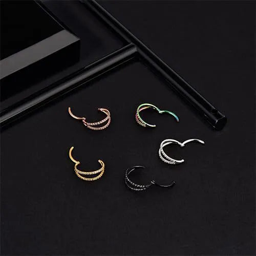 G23 titanium alloy lip and nose ring body jewellery in gold and steel colour finishes, showing different gauge sizes.