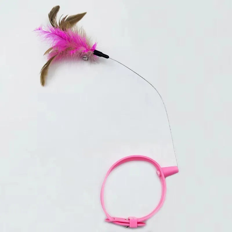 Blue adjustable cat collar with attached silicone wand and a feather and bell toy.