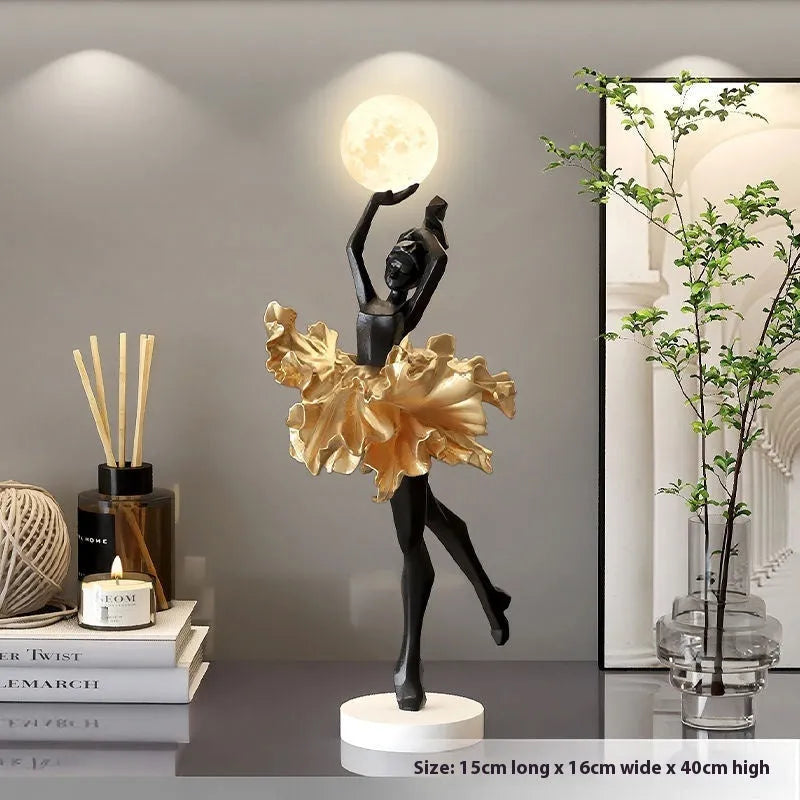 Small modern resin night light ornament with USB charging cable in black gold colour.