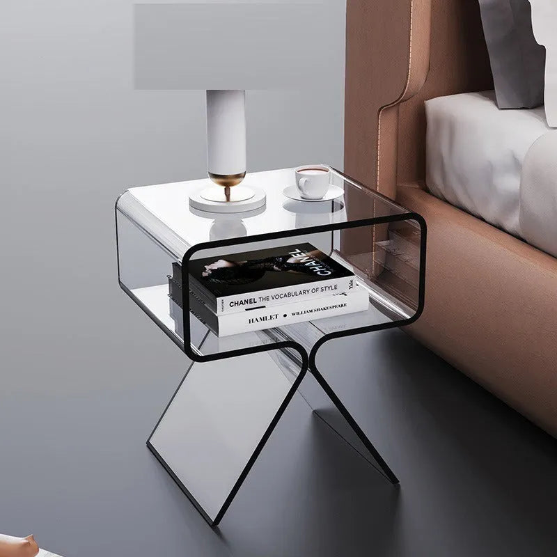 Transparent acrylic side table with bracket frame in living room setting