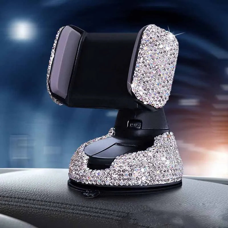 Diamond-encrusted car phone holder mounted on air vent with adjustable push-button mechanism and smartphone securely held