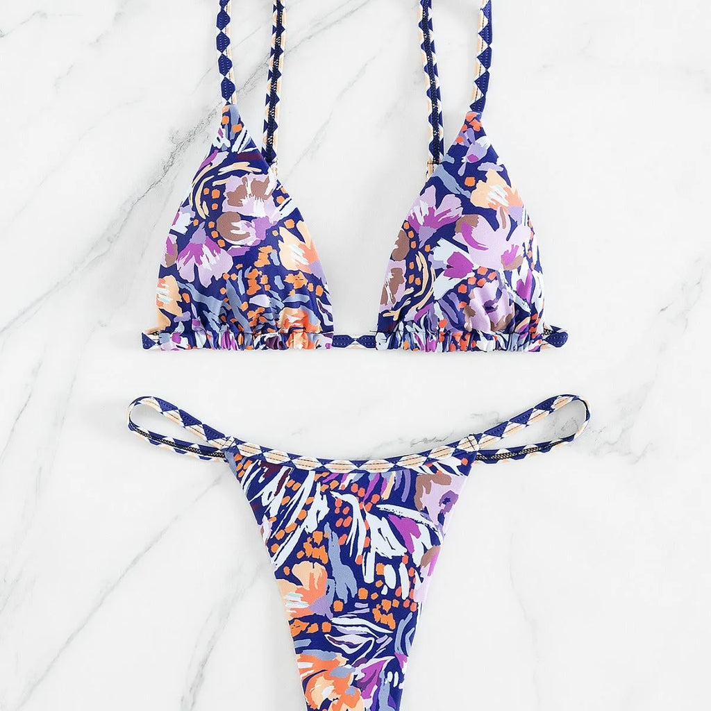 Women's floral print triangle top bikini swimsuit with briefs style bottoms in polyester fabric.