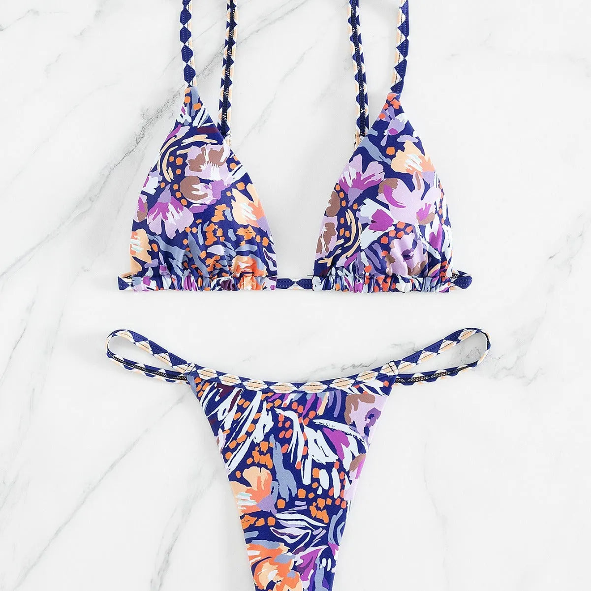 Women's floral print triangle top bikini swimsuit with briefs style bottoms in polyester fabric.
