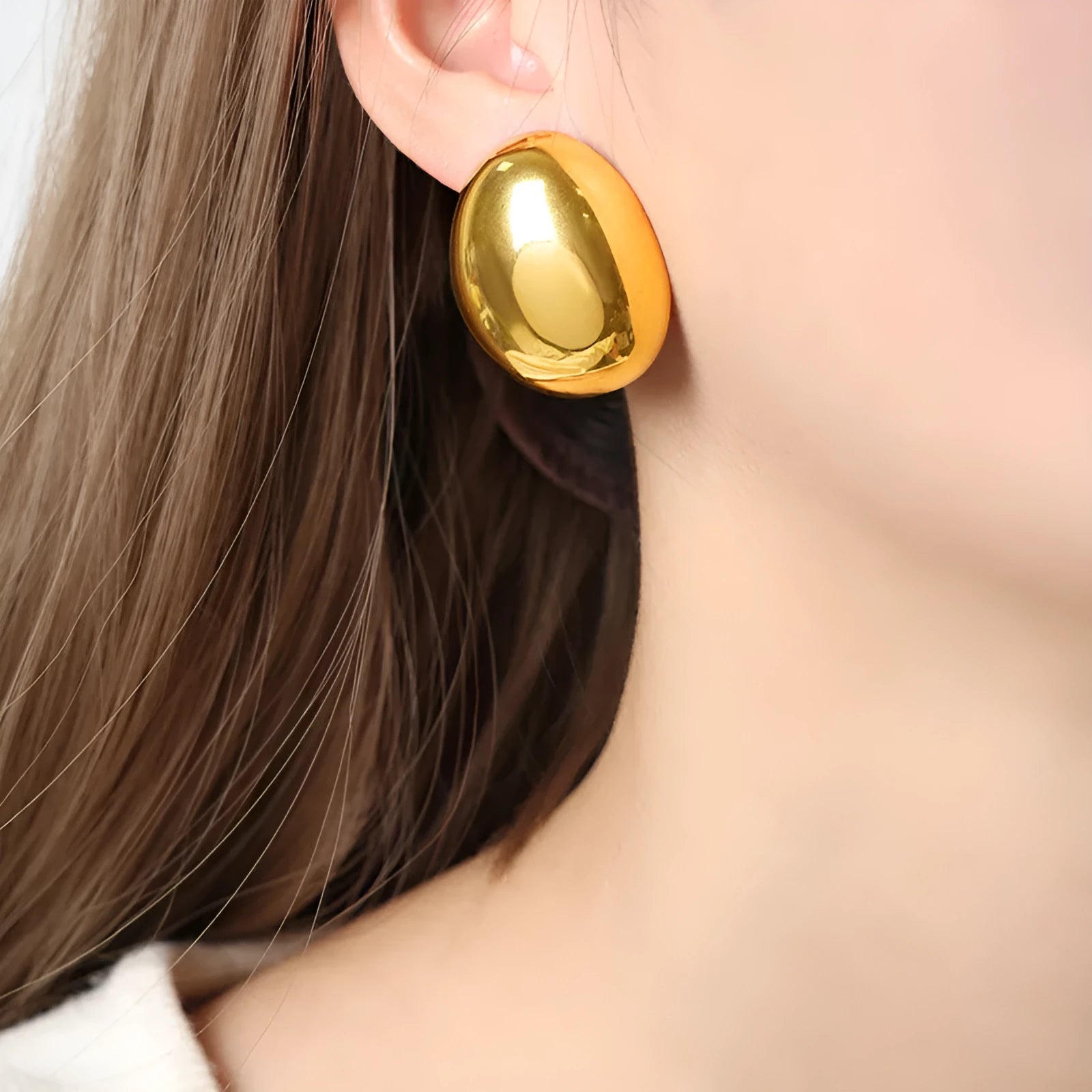 Geometric stainless steel ear studs with a glossy 18K gold tone electroplated finish