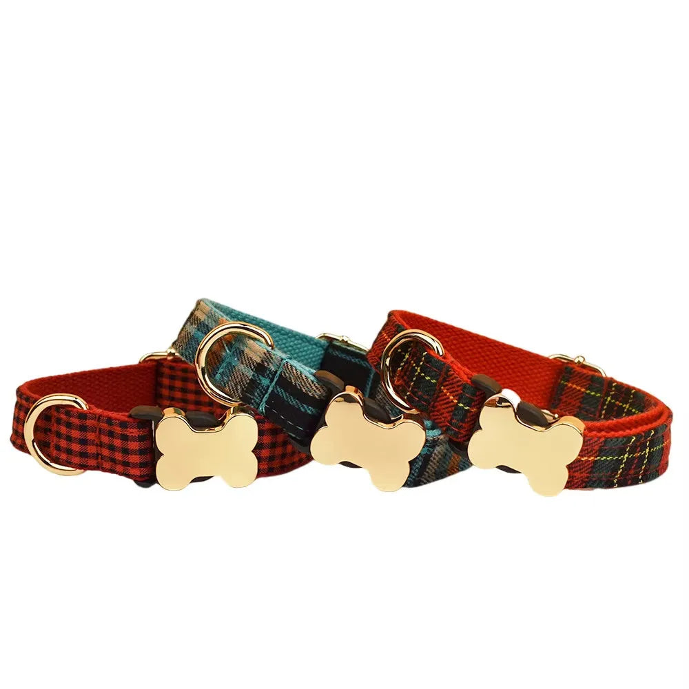 Flat nylon dog collar with a grid print and metal bone-shaped buckle on a white background.