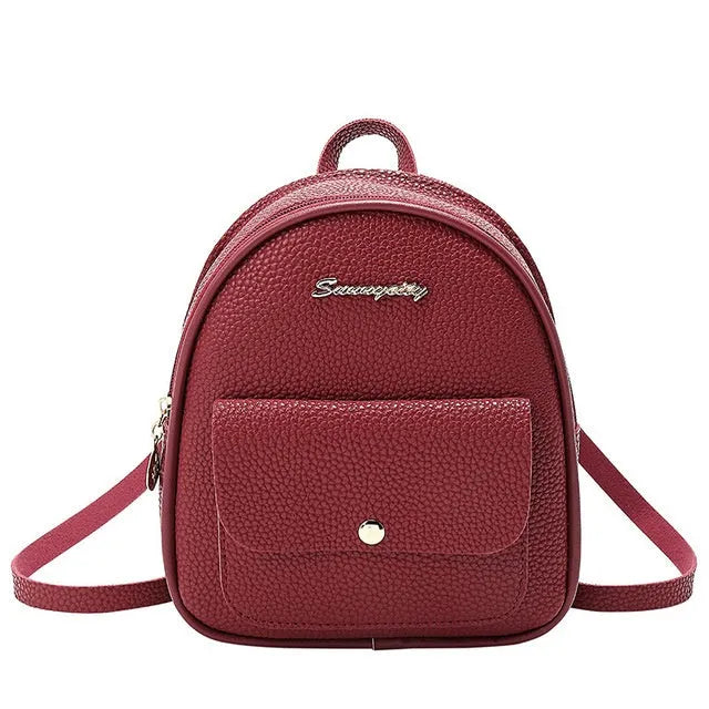 Small black PU women's letter-shaped shoulder bag worn as a backpack.