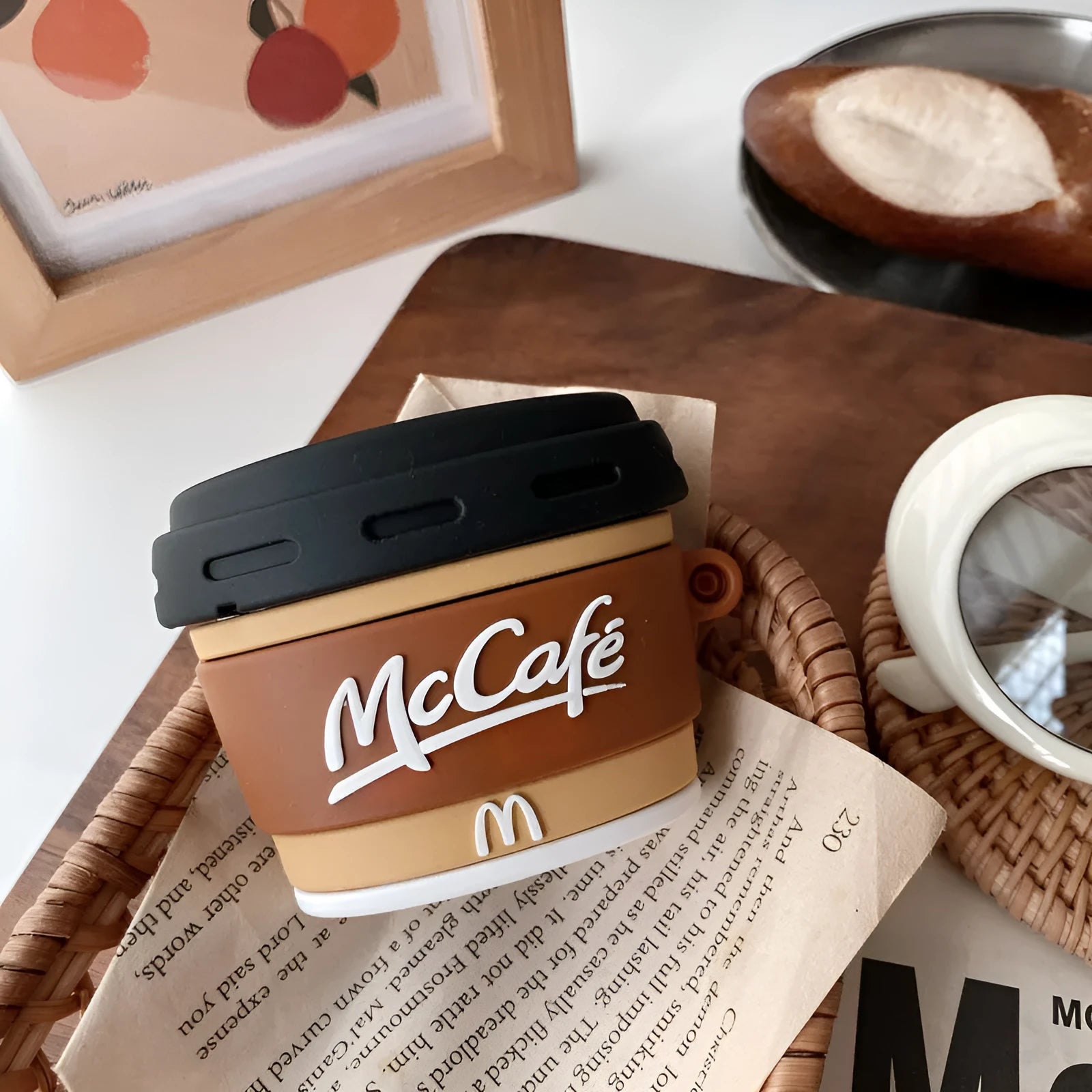 Brown silicone coffee cup-shaped earphone case for Apple AirPods with irregular printed design, front view, compatible with AirPods 1/2 and Pro 3