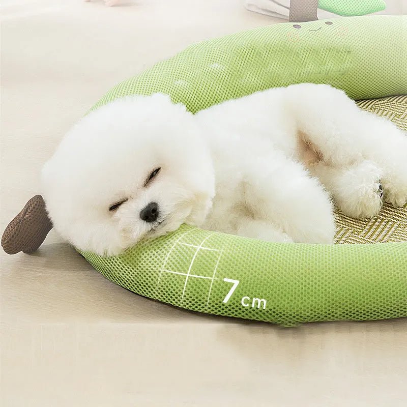 Green pet cooling mat with a raised fruit-shaped backrest, sized for a large dog.