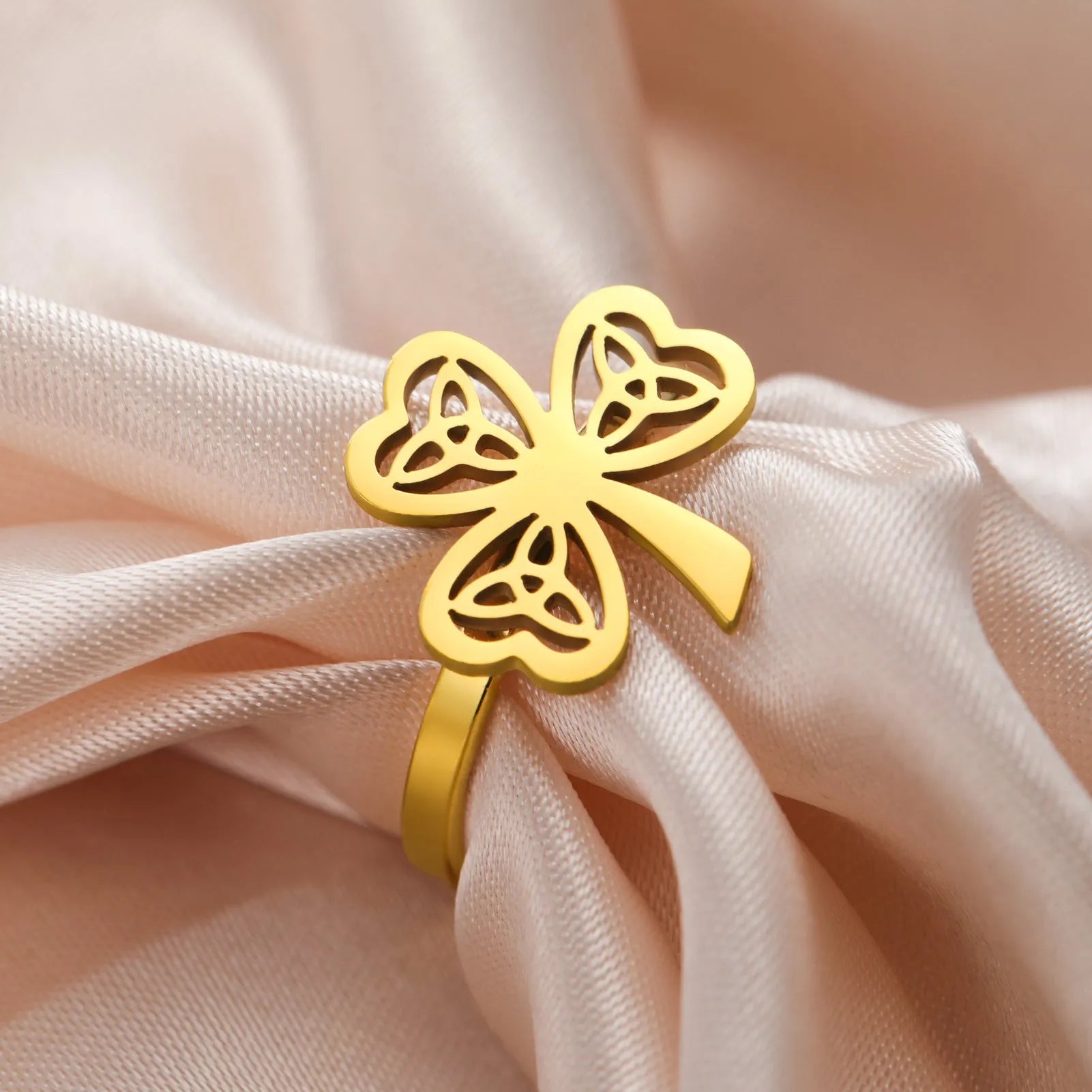 Stainless steel hollow ring shown in gold and steel colour finishes on hand