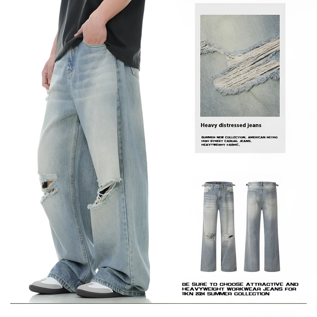 Blue men's straight-leg jeans with ripped detailing and a zip fly on a plain background.