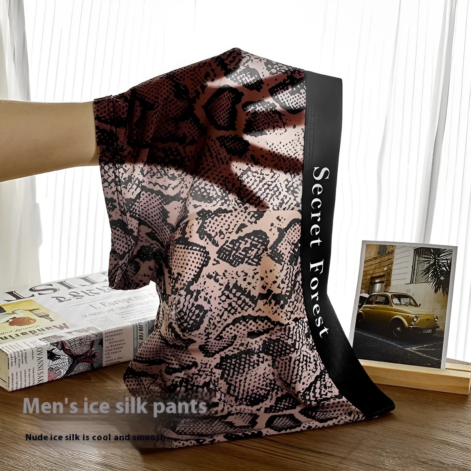 Men's thin polyester boxer shorts in black colour showing mid waist design and loose fit