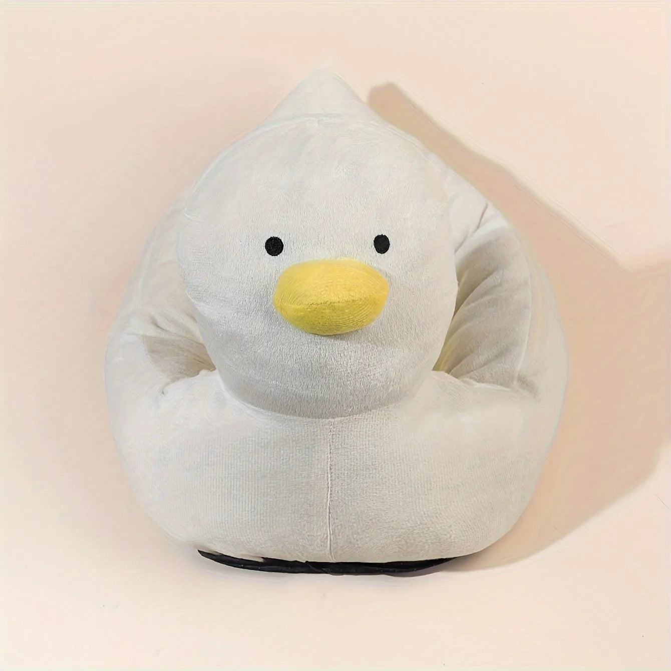 Blue duck-shaped fluffy pet bed for a small dog, showing raised rim and soft material.