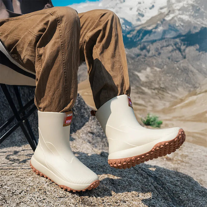 Men's PVC oversleeve rain boots in beige with a non-slip plastic sole.