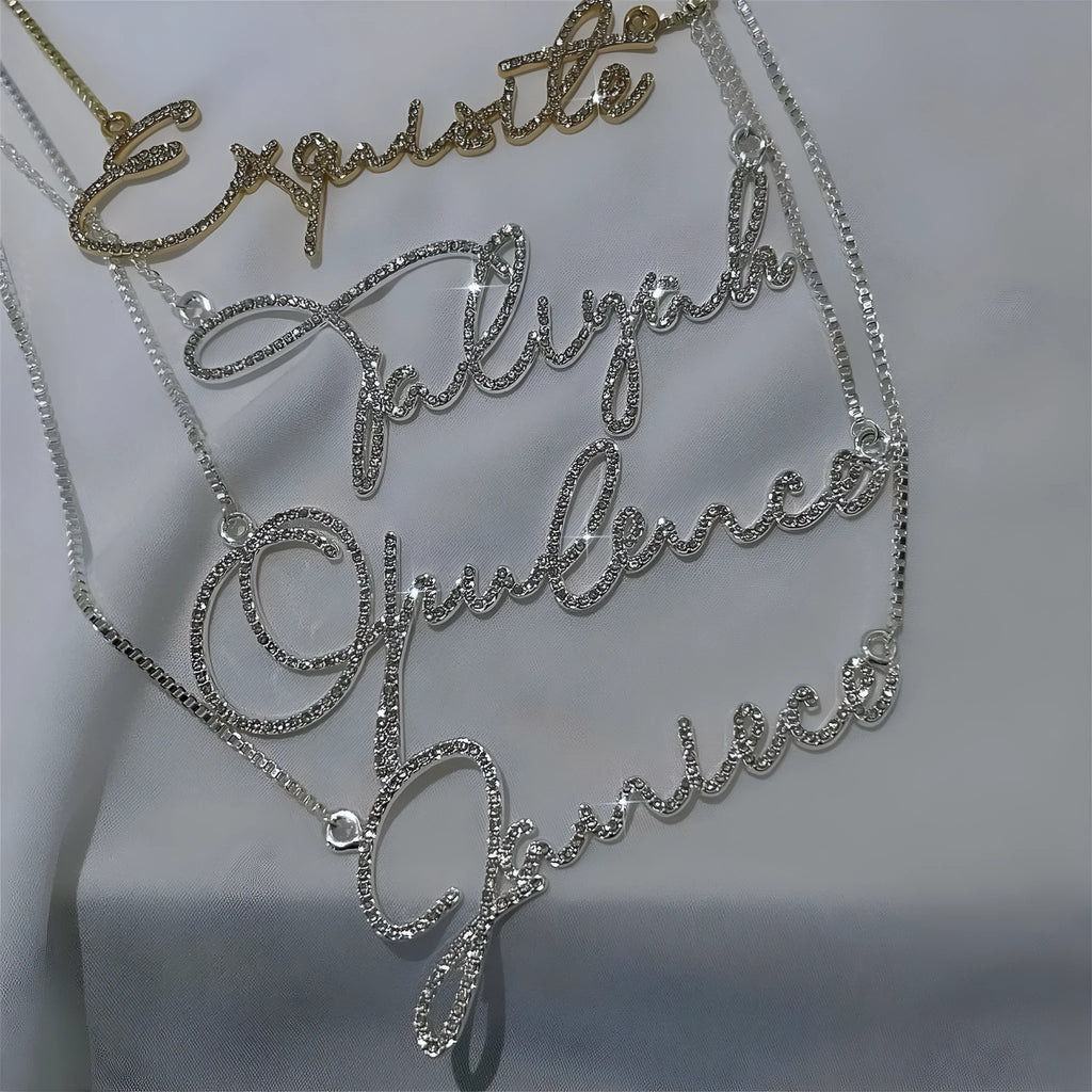 Personalised stainless steel name necklace with diamond-studded letters in silver, shown at an adjustable length.