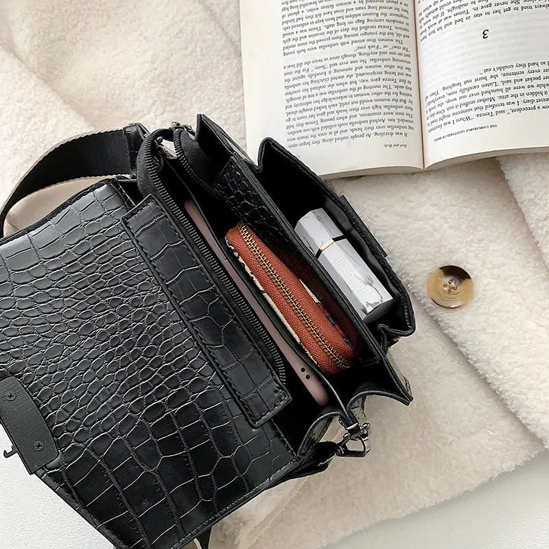 A PU fabric crossbody bag with an adjustable strap, shown in dark brown colour.