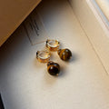 Geometric tigereye stone earrings for women with gold plating in brown and black colour options.