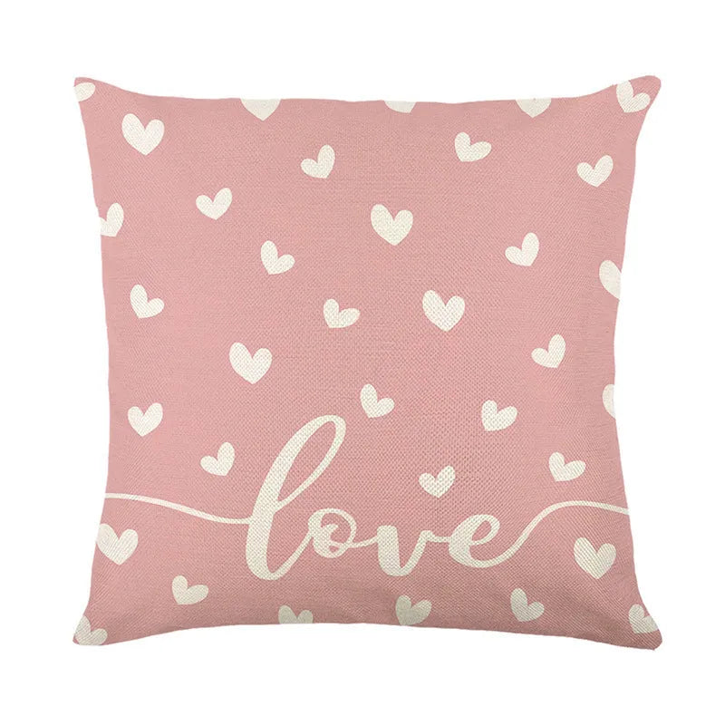 Square red and white plaid cushion cover with heart motifs, measuring 45cm, on a grey sofa.