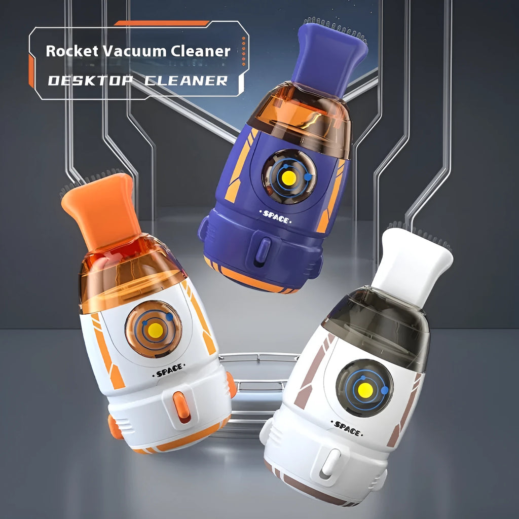 Blue rocket-shaped USB rechargeable handheld desktop vacuum cleaner on a wooden desk next to a keyboard