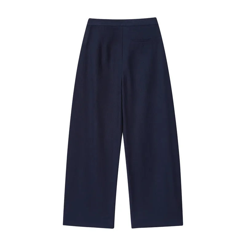 Women's high-neck blouse with flounced sleeves and matching wide-leg trousers in a formal suit set.