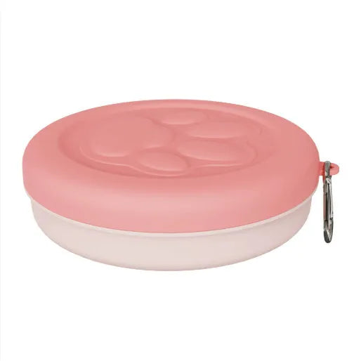 Collapsed and open views of a pink silicone dog bowl with matching sealing lid, next to a dog lead.