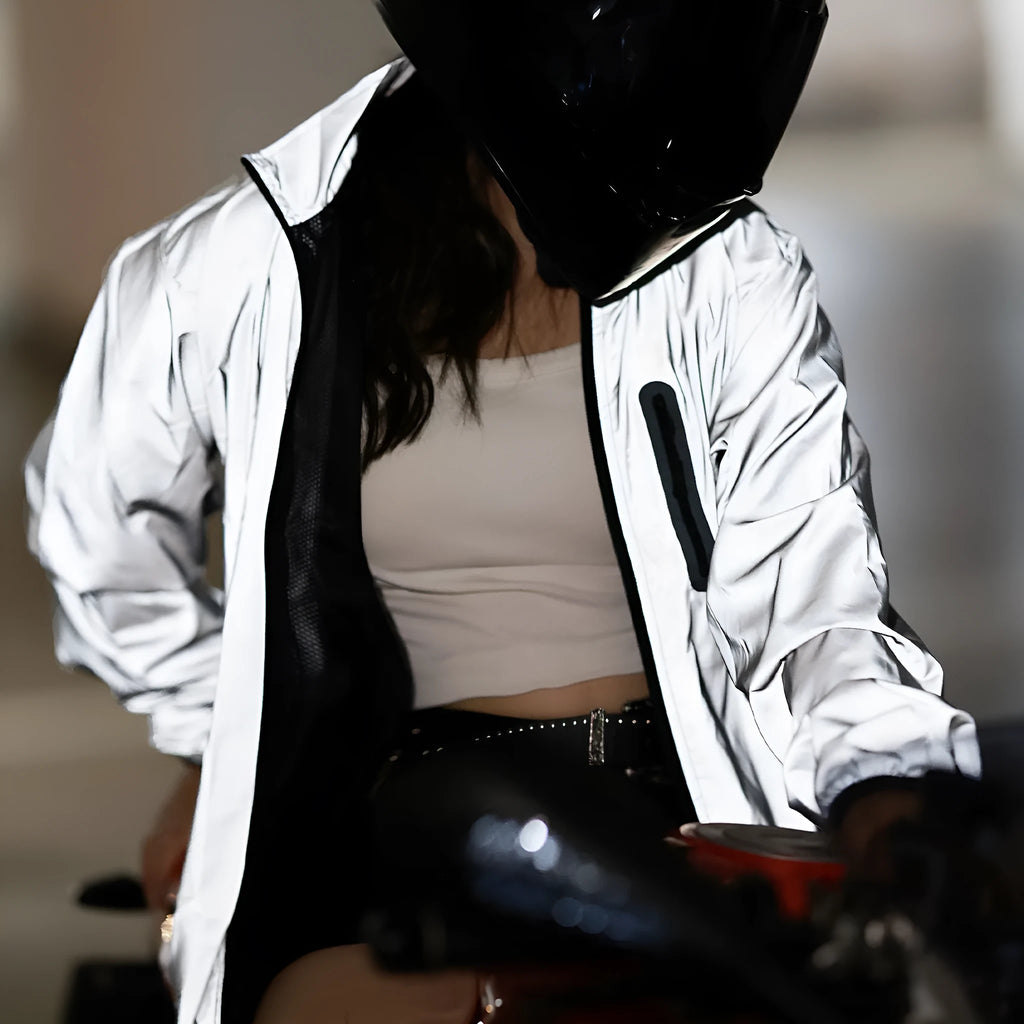 Silver waterproof polyester long sleeved jacket showing front view with size label indicating Asian and European conversion