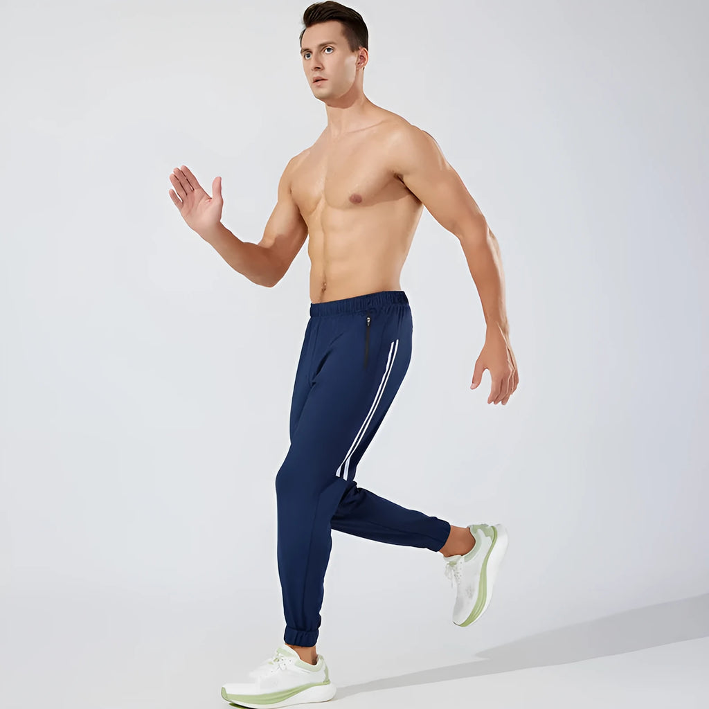 Men's black breathable polyester running trousers with a mid-waist design.