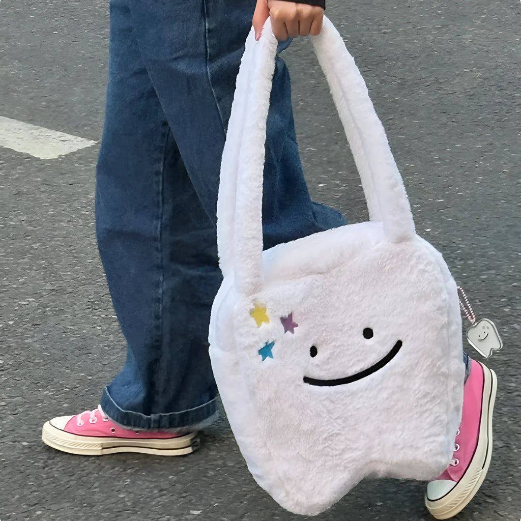 White plush shoulder tote bag with cute teeth design and zip opening