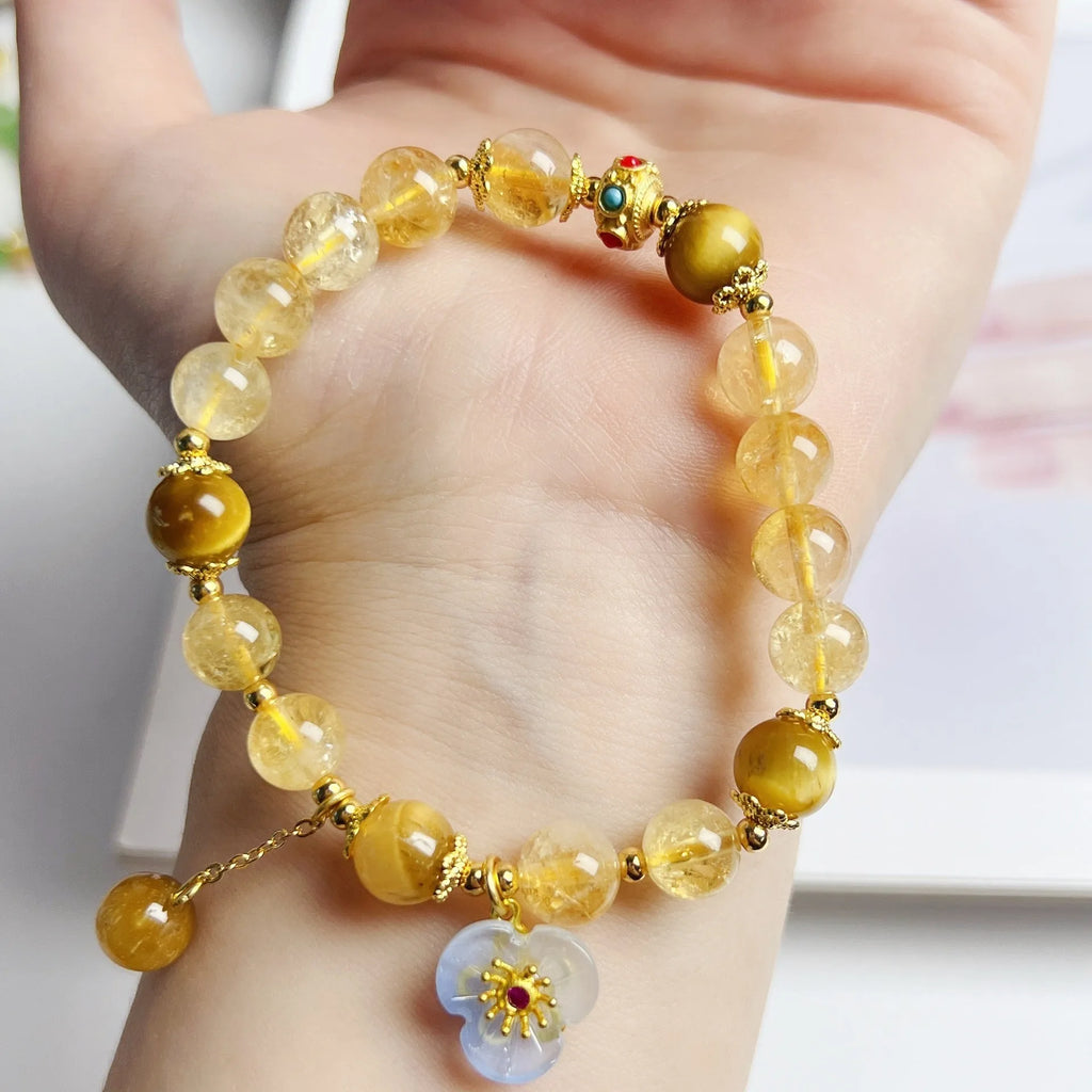 Handcrafted citrine crystal bracelet for women with a flower tassel in original design.