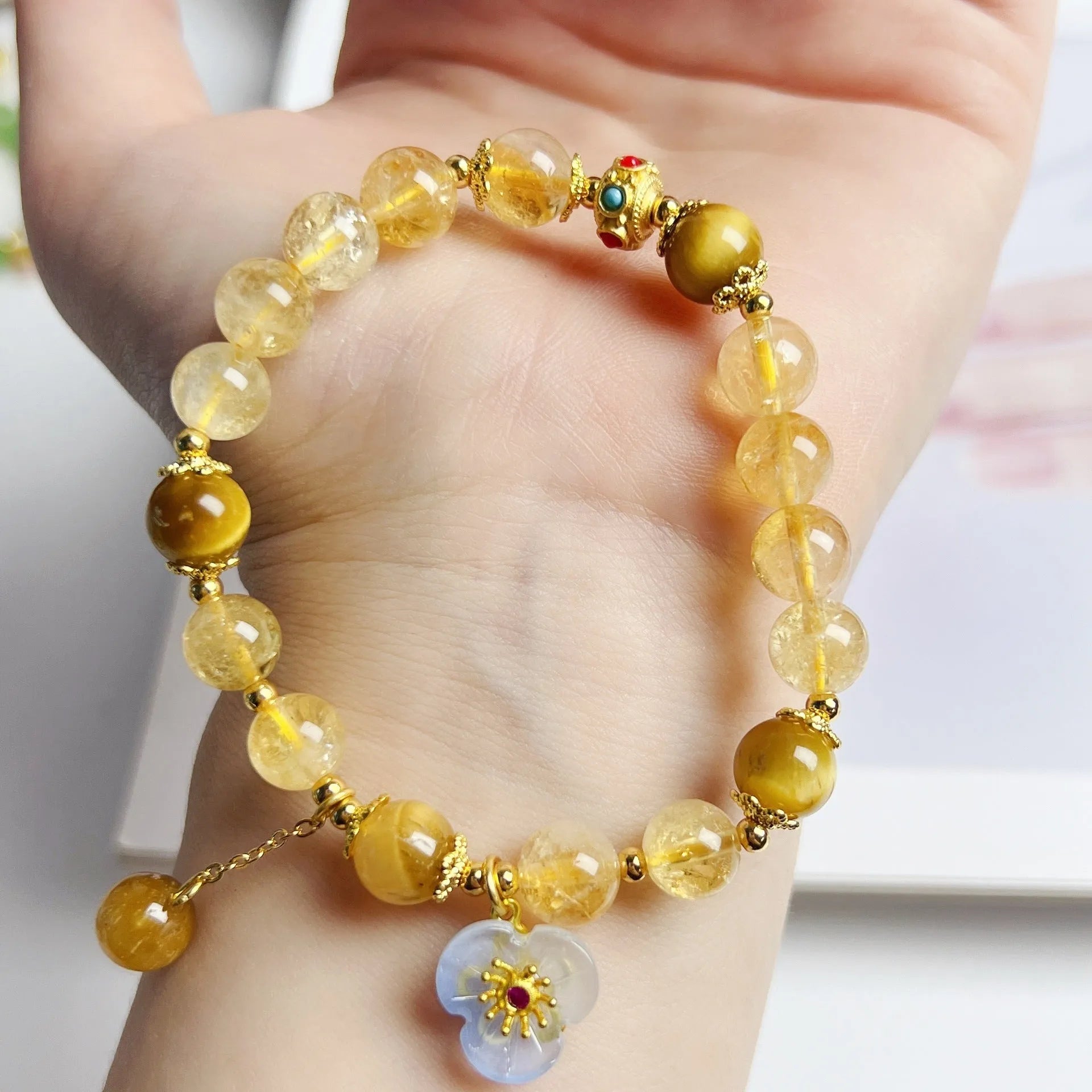 Handcrafted citrine crystal bracelet for women with a flower tassel in original design.